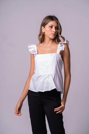 Blusa romántica con boleros en las mangas y bordado frontal.