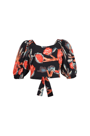 Blusa tipo crop top con tiras y estampado rojo con fondo negro.