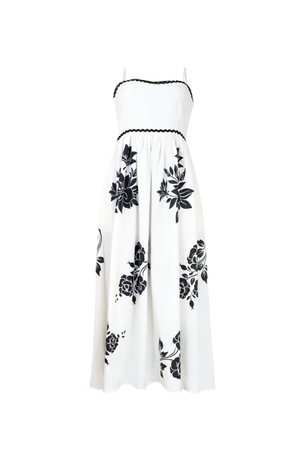 Vestido largo y blanco con estampado y apliques elegantes.