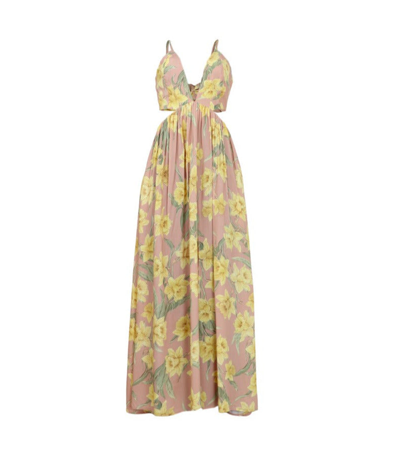 Vestido rosa, largo de tiras con cortes en cintura y falda fluida.